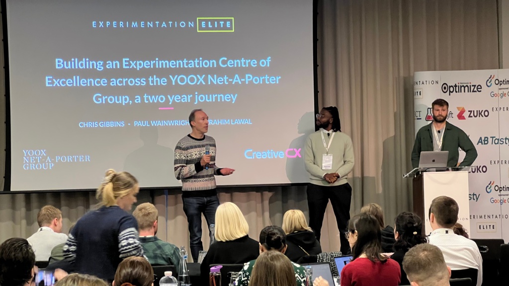 Creative CX on stage at the Experimentation Elite conference talking about YNAP's Centre of Excellence