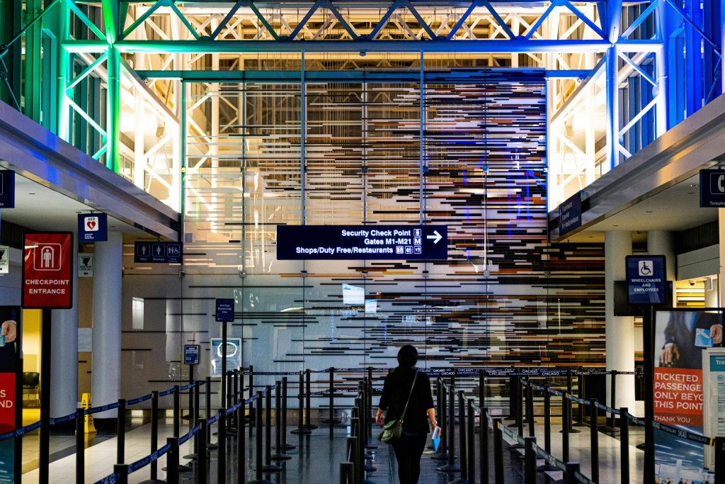 Modern airport terminal with natural light and no crowds, a visual contrast to the underlying inefficiencies discussed in the article on assumption-led changes in testing experimentation.