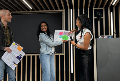 Participants present their evidence-led solution during Creative CX's Experimentation Day with Heathrow, showcasing ideas developed through collaborative ideation and paper prototyping.